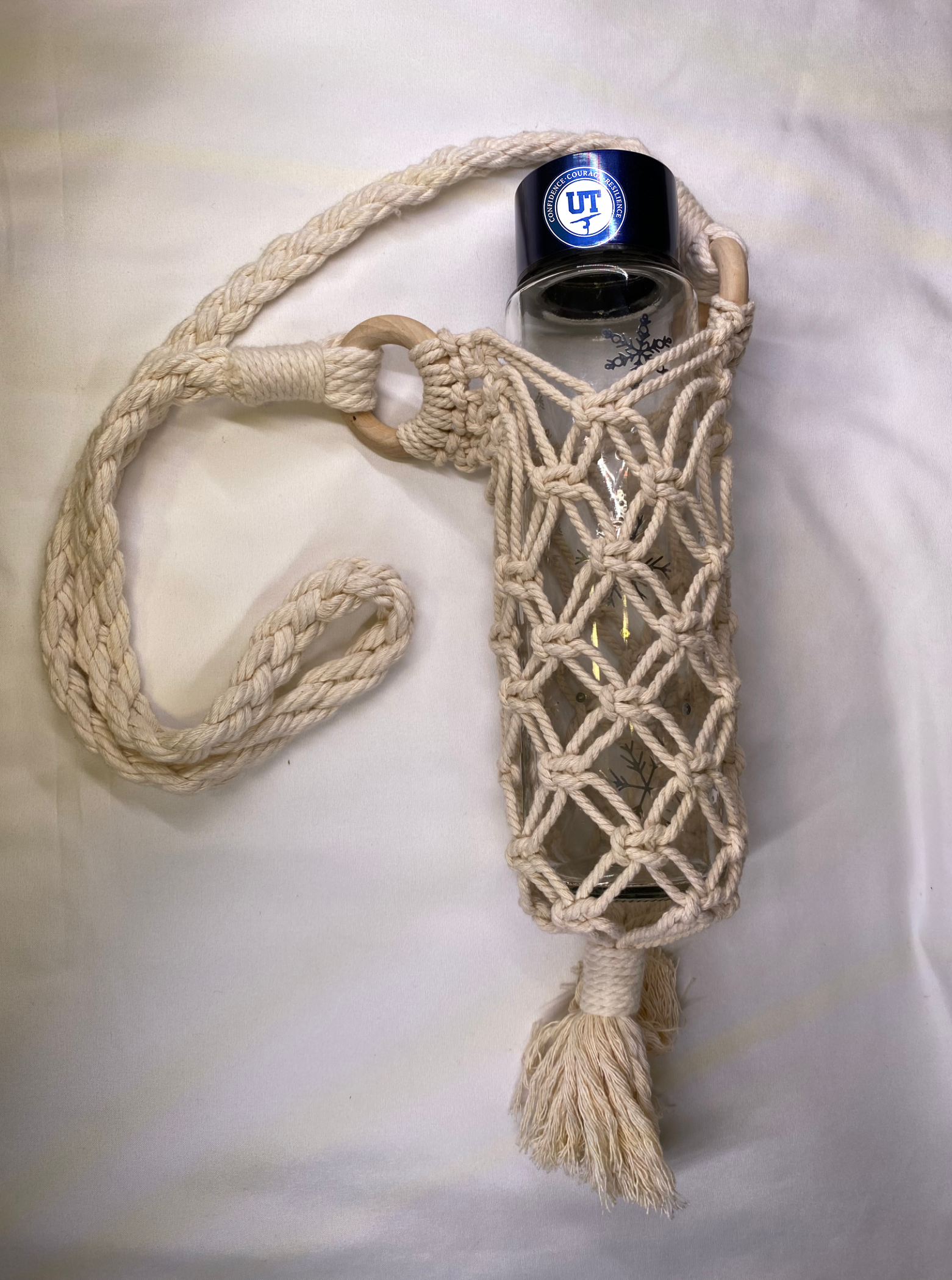Protective Macrame Sleeve with strap for water bottles.